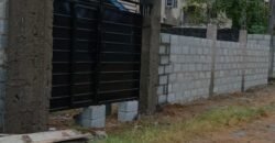 Fully Fenced and Gated Plot of Land with Tenement Bungalow