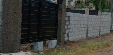 Fully Fenced and Gated Plot of Land with Tenement Bungalow
